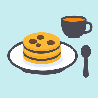 Cookies on a plate with tea on the side.
