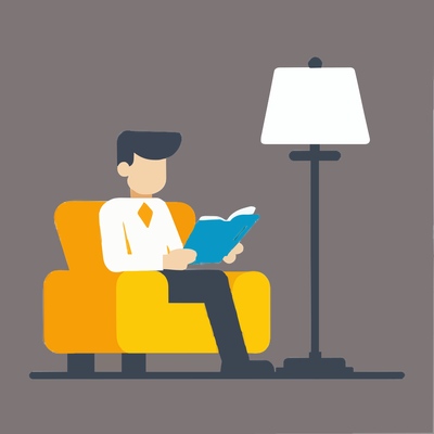 Man sitting on a sofa, reading a book, next to a floor lamp.